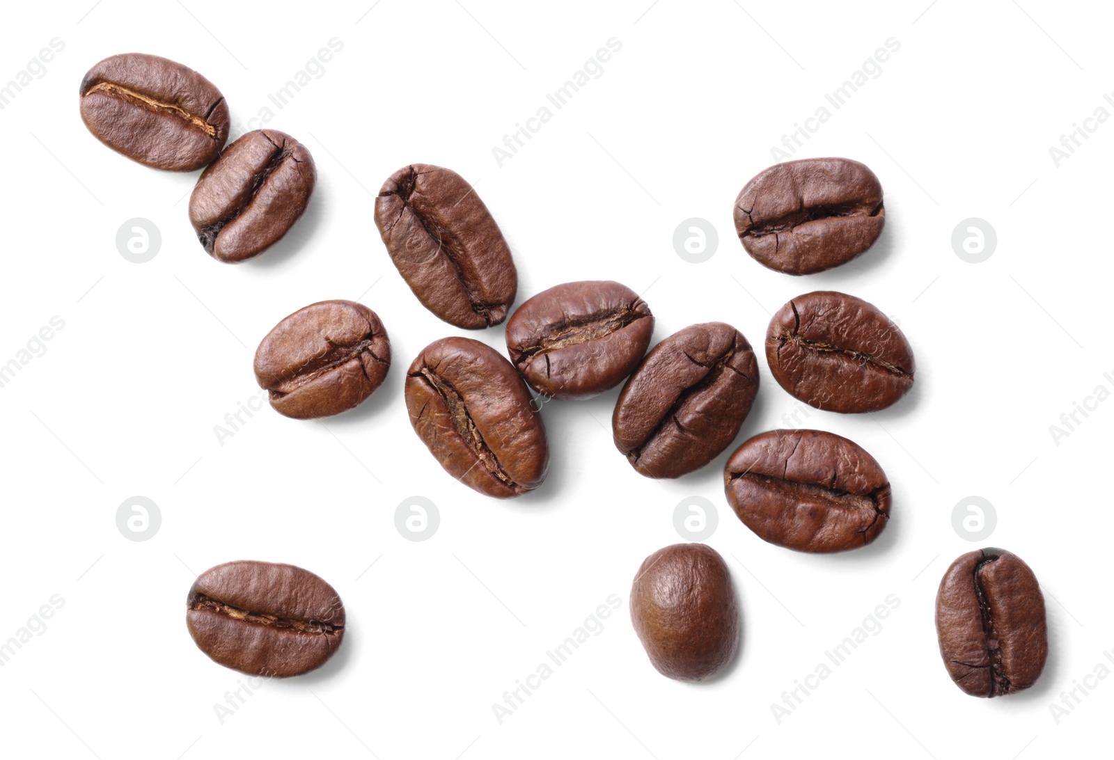 Photo of Many roasted coffee beans isolated on white, top view