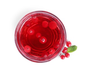 Photo of Tasty refreshing cranberry juice and fresh berries isolated on white, top view
