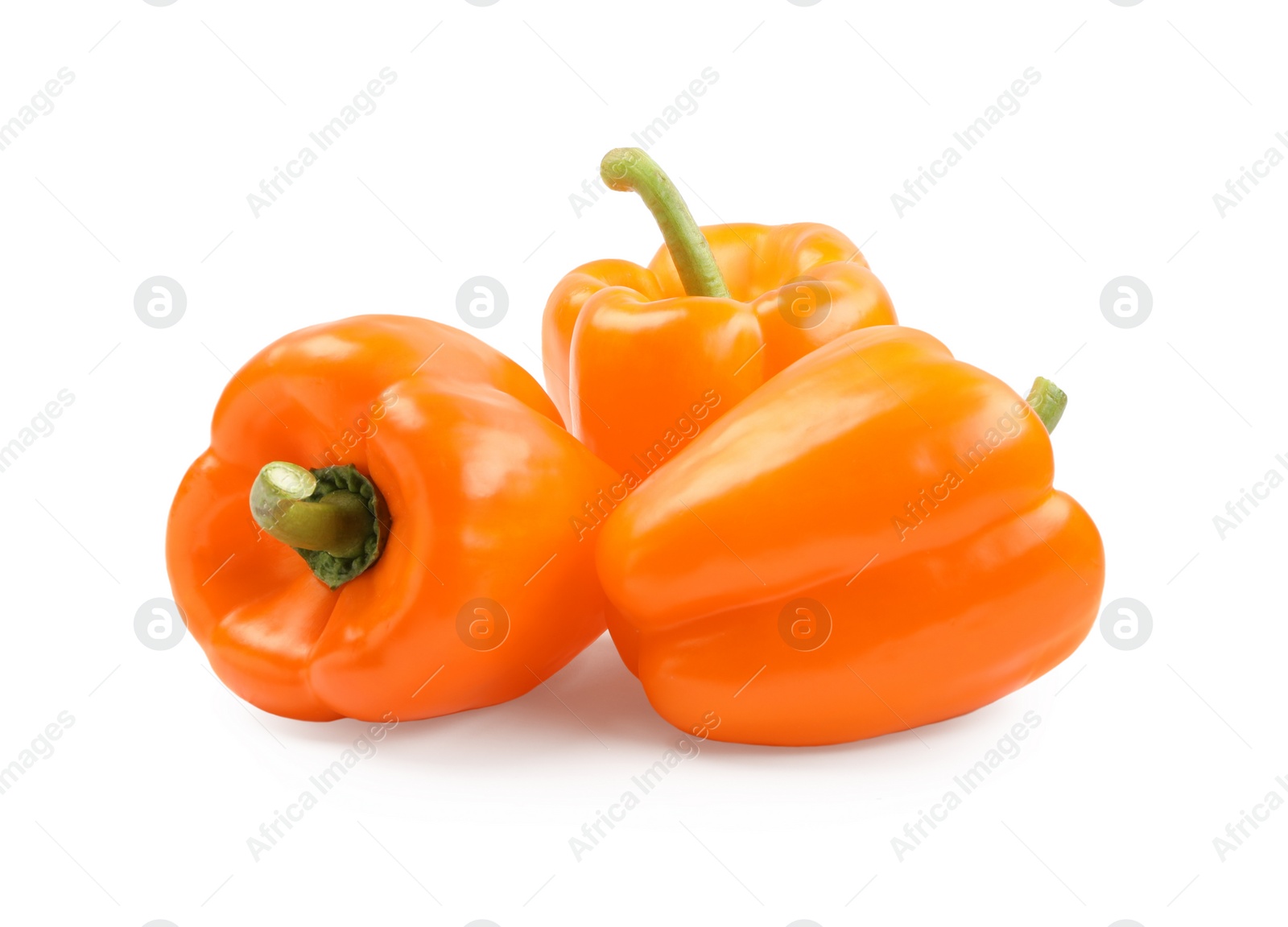 Photo of Ripe orange bell peppers isolated on white