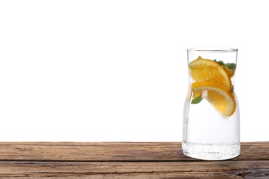 Photo of Delicious refreshing citrus drink on wooden table.