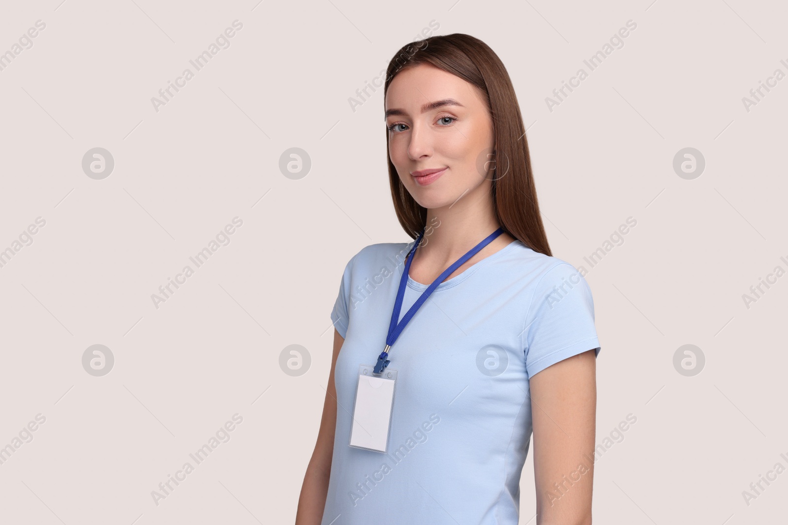 Photo of Woman with blank badge on grey background, space for text