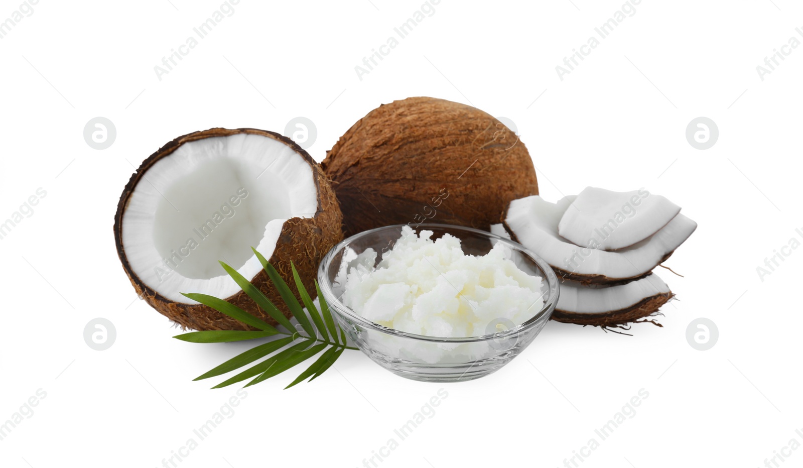 Photo of Organic coconut cooking oil, fresh fruits and leaf isolated on white