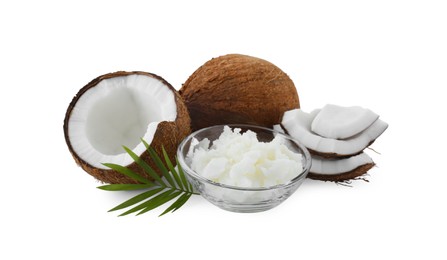 Organic coconut cooking oil, fresh fruits and leaf isolated on white