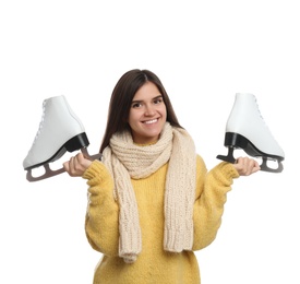 Happy woman with ice skates on white background