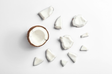 Photo of Composition with coconut pieces on white background, top view