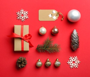Photo of Flat lay composition with Christmas decor on red background