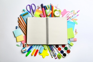 Photo of Blank notebook and school stationery on white background, flat lay with space for text. Back to school