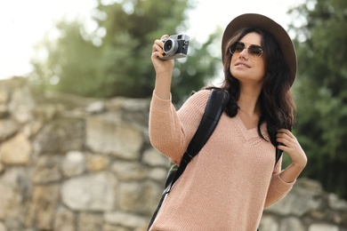 Traveler with photo camera on city street