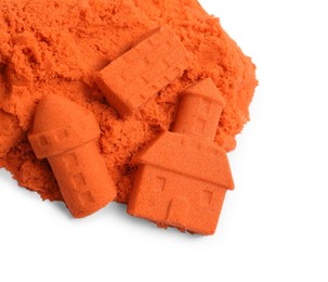 Photo of Castle figures made of orange kinetic sand isolated on white, top view
