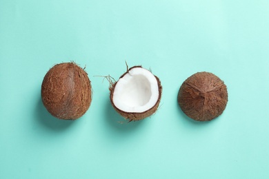 Photo of Ripe coconuts on color background