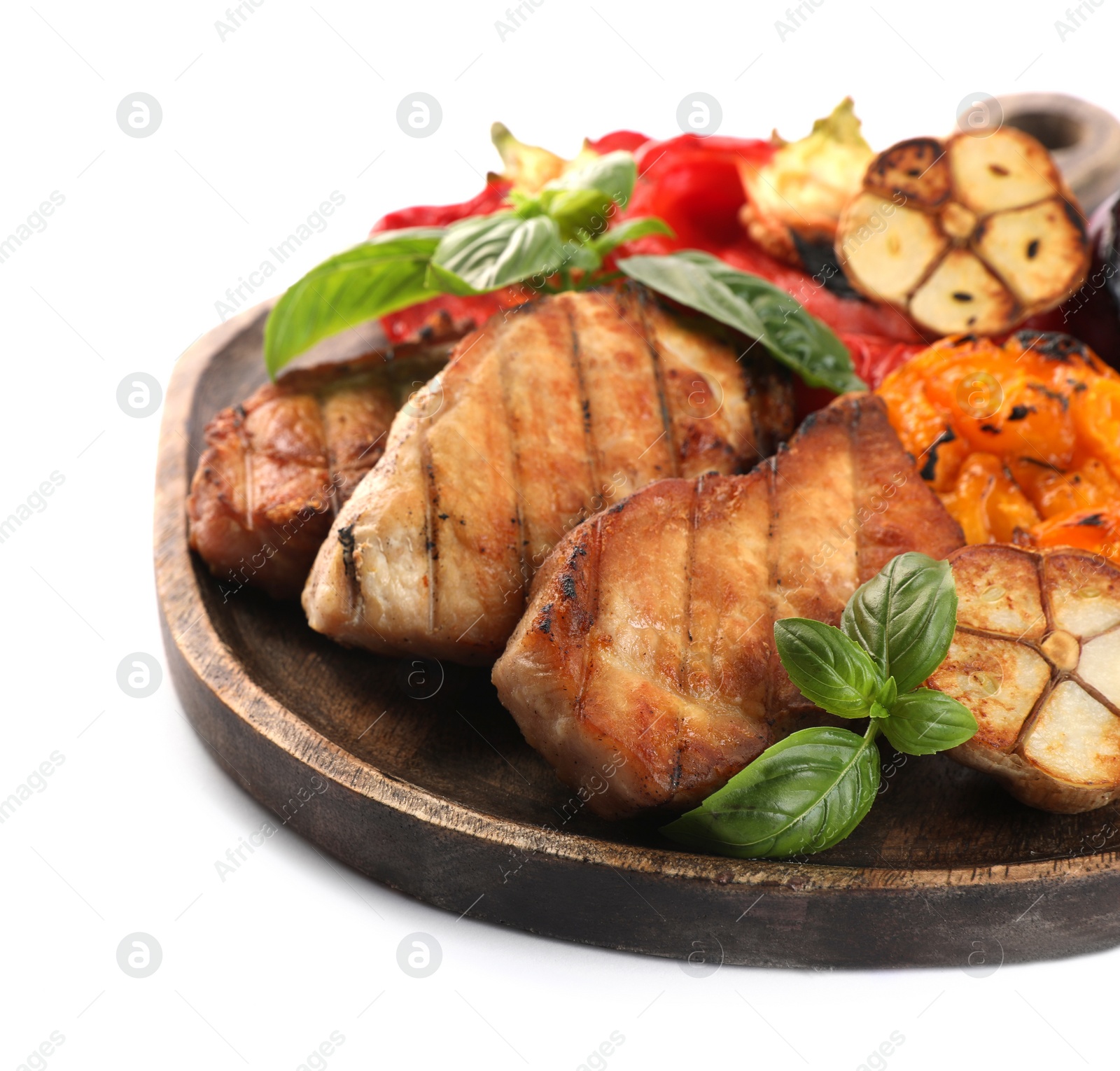 Photo of Board with tasty grilled vegetables, meat and basil isolated on white