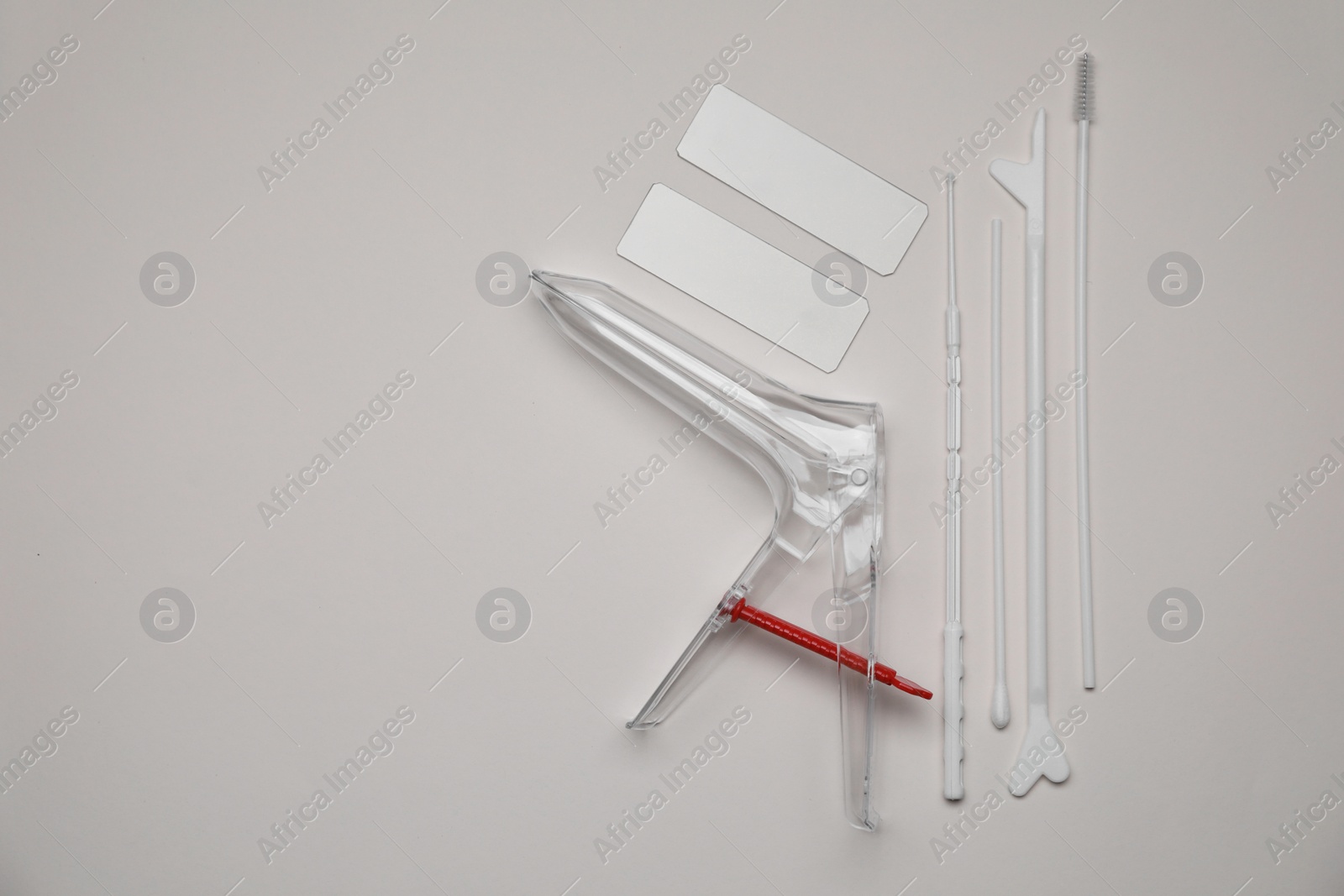 Photo of Sterile gynecological examination kit on beige background, flat lay. Space for text
