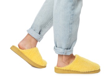 Woman in yellow soft slippers on white background, closeup