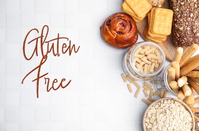 Image of Different gluten free products on white tiled table, flat lay