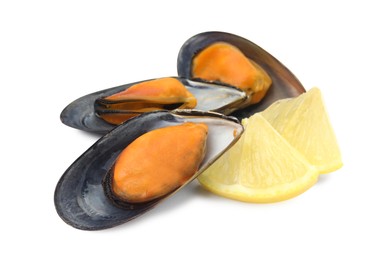 Delicious cooked mussels with lemon on white background