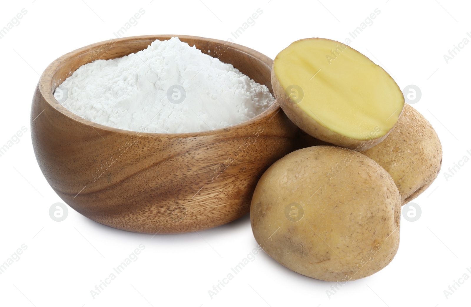 Photo of Wooden bowl of starch and fresh raw potatoes on white background