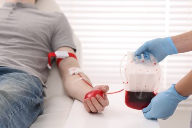 Photo of Patient undergoing blood transfusion in hospital, closeup