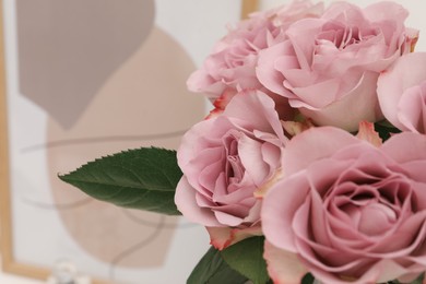 Photo of Bouquet of pink roses indoors, closeup. Space for text