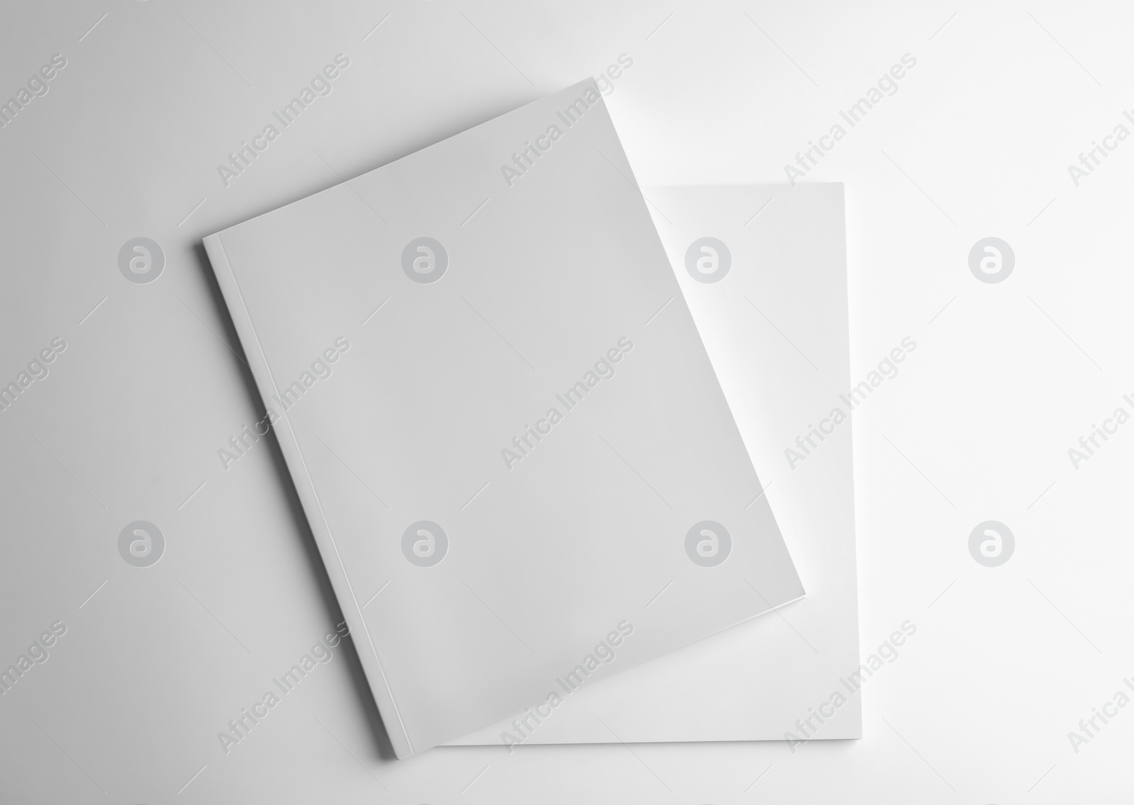 Photo of Blank books on white background, top view. Mock up for design