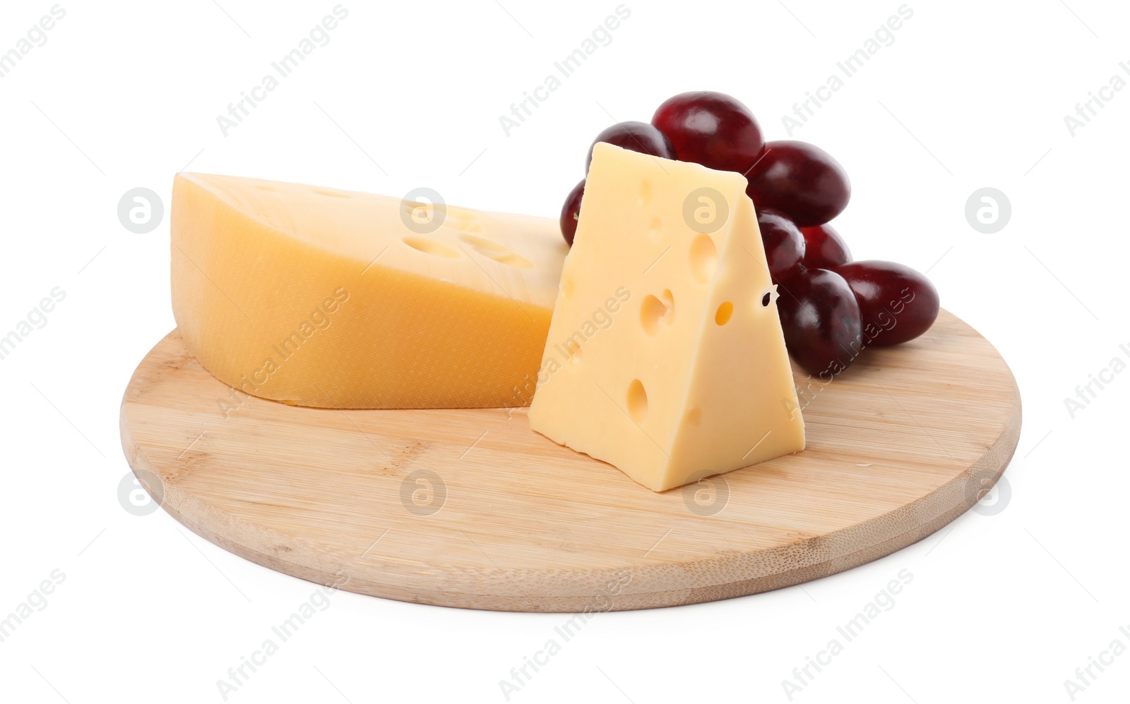 Photo of Pieces of delicious cheese and grapes isolated on white