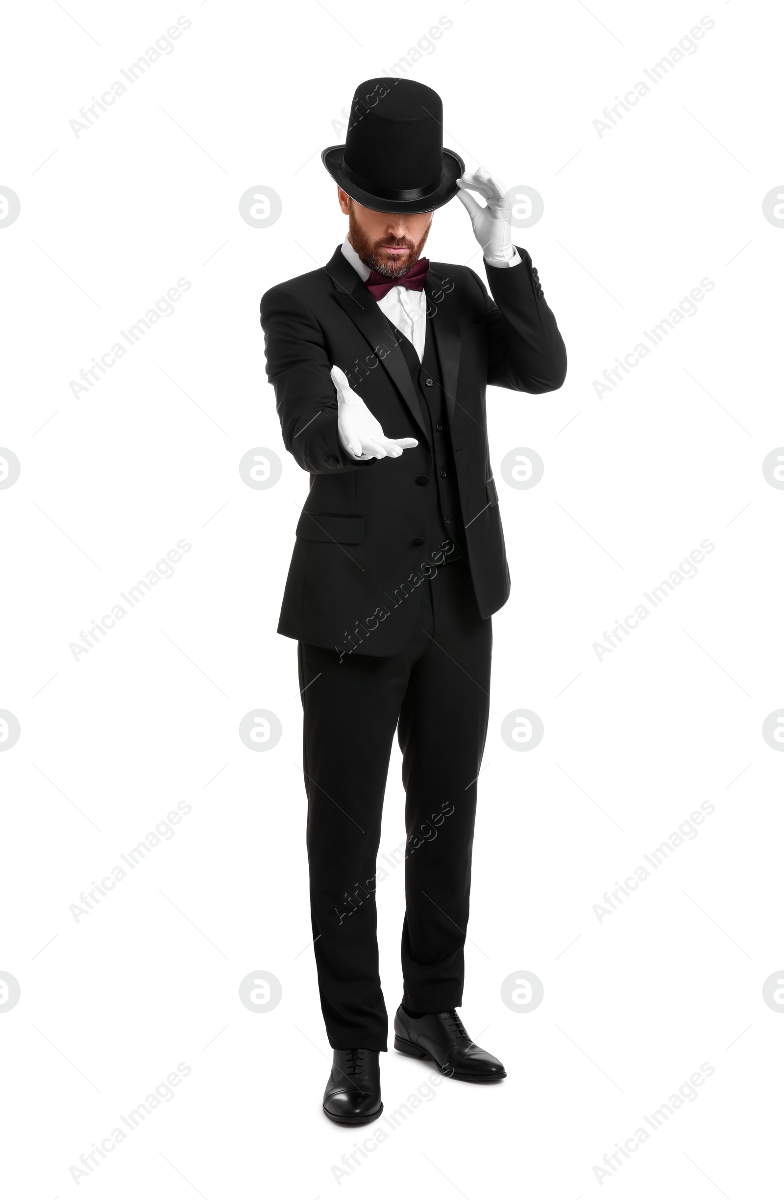 Photo of Magician in top hat on white background