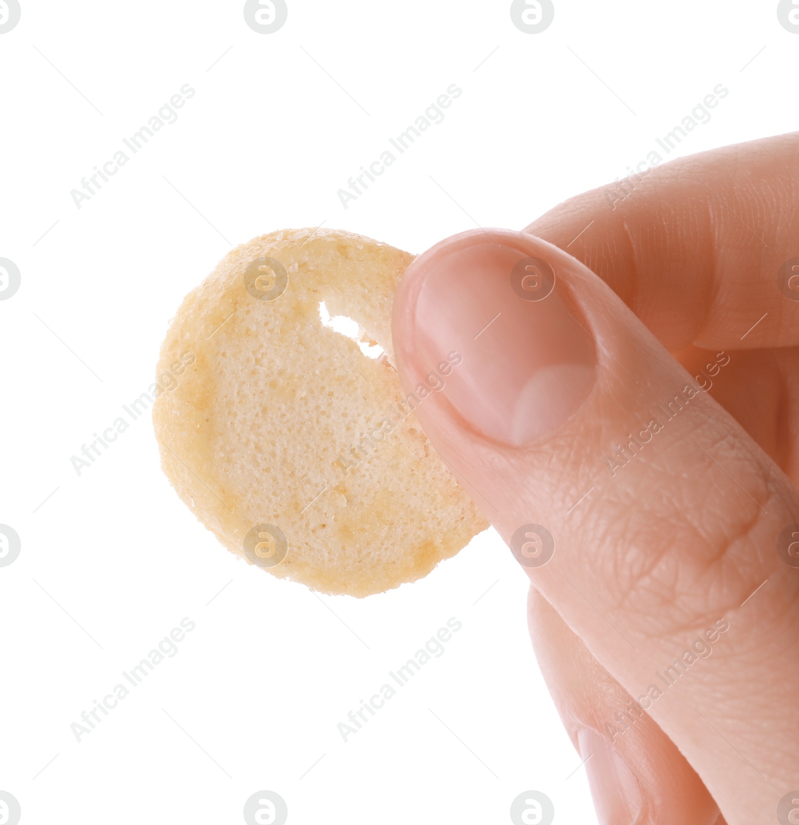 Photo of Woman holding crispy rusk on white background, closeup