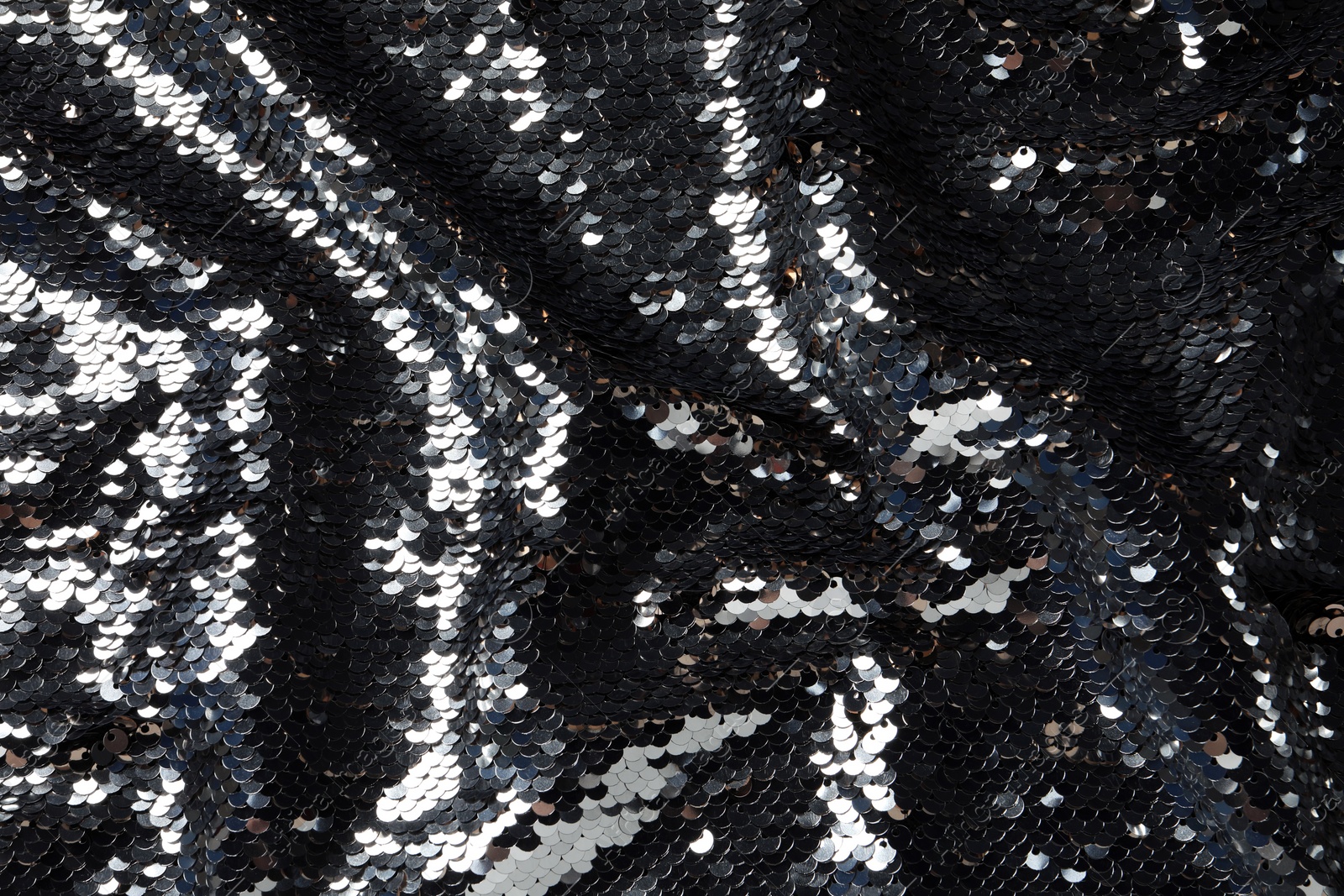 Photo of Texture of beautiful bright sequins as background, closeup