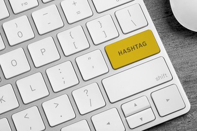 Image of Yellow button with word HASHTAG on computer keyboard, top view