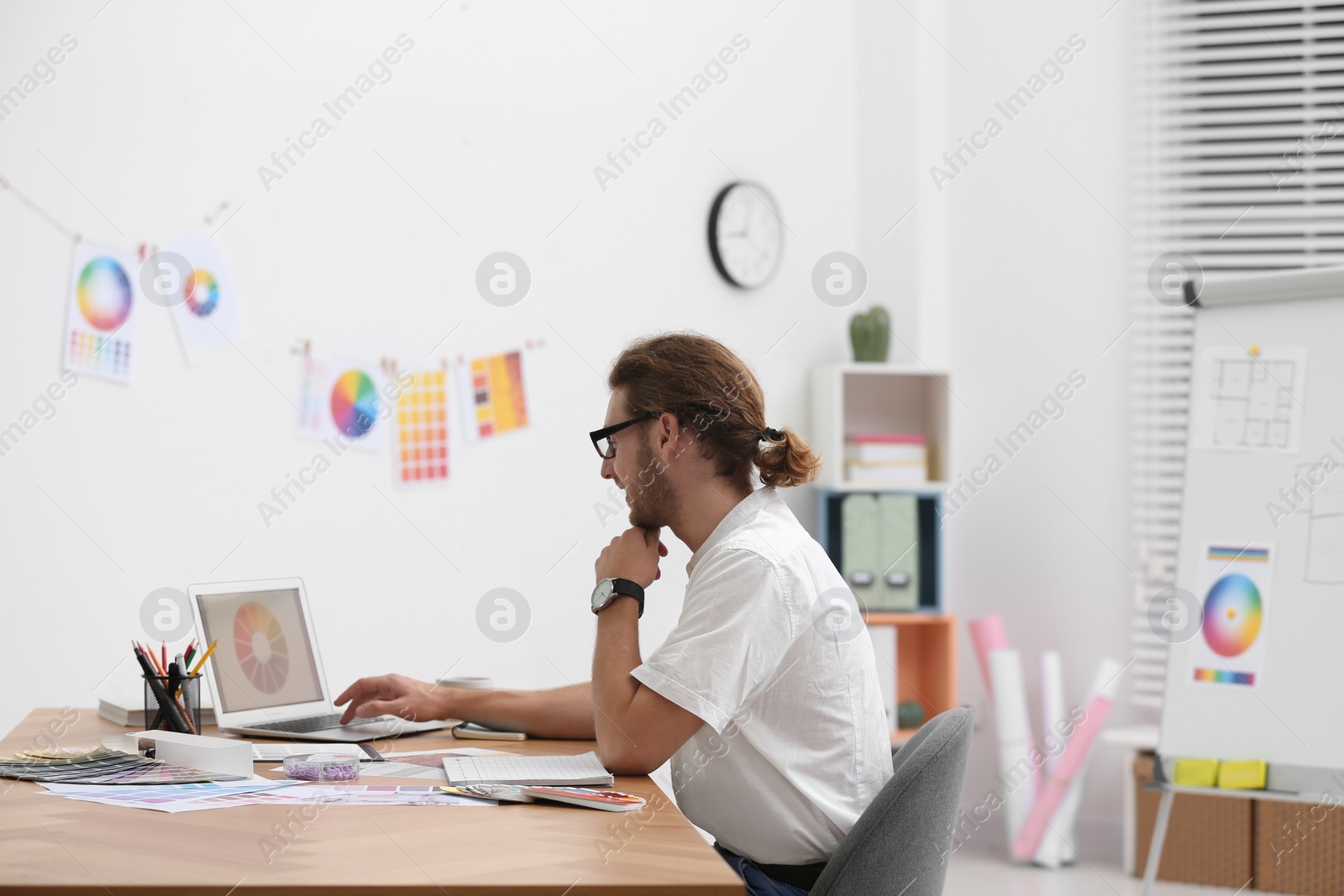 Photo of Professional interior designer at workplace in office