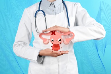 Image of Doctor demonstrating virtual image of infected female reproductive system on blue background, closeup. Vaginal candidiasis