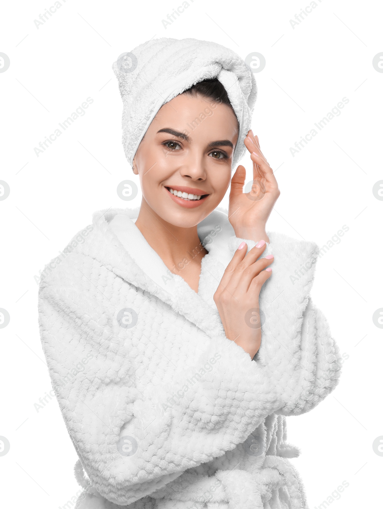 Photo of Happy young woman in bathrobe with towel on head against white background. Washing hair