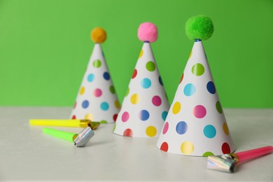 Photo of Birthday party hats and horns on light table
