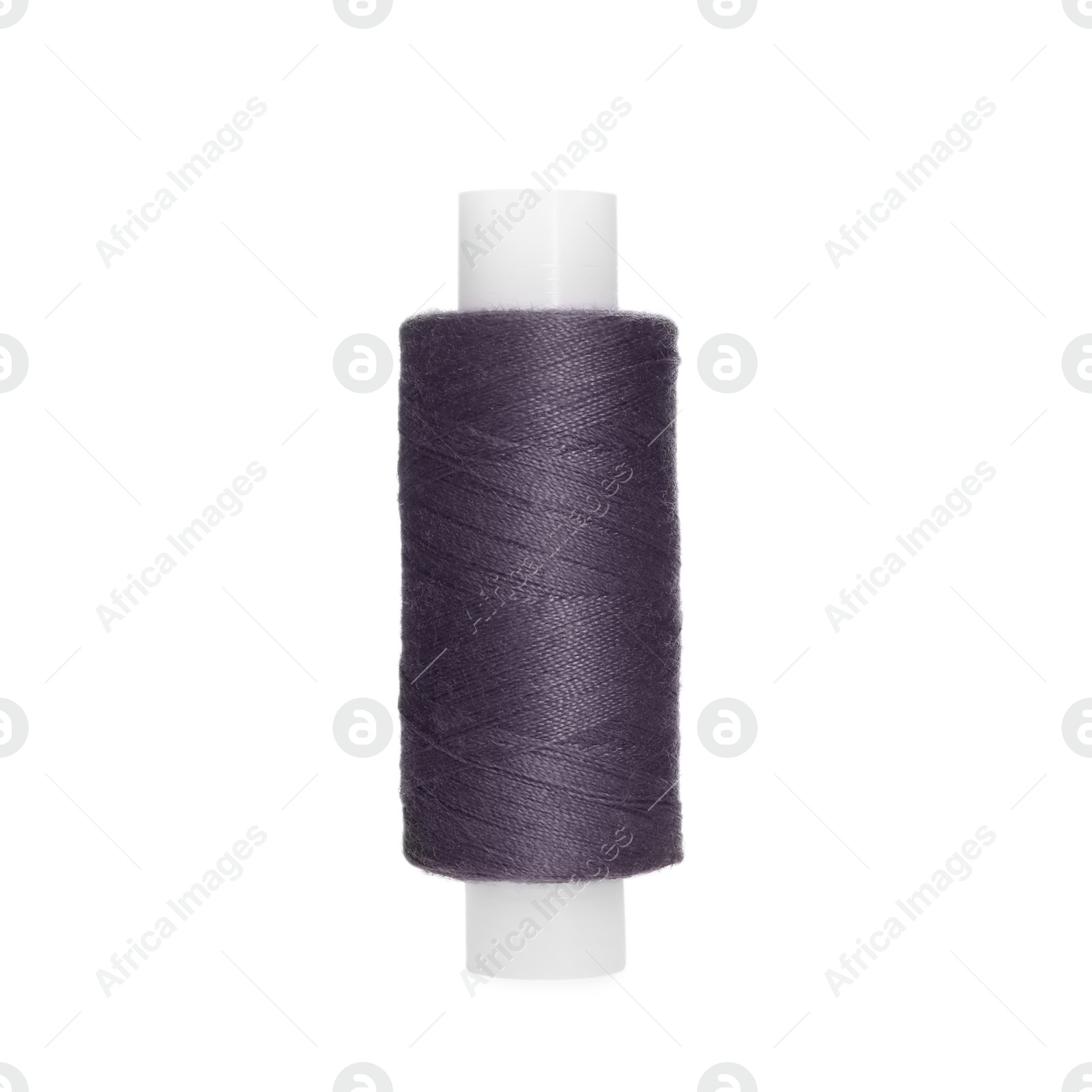 Photo of Spool of dark grey sewing thread isolated on white