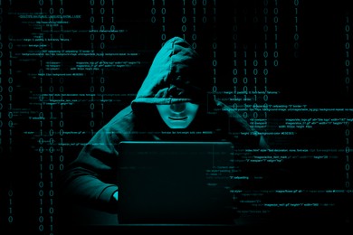 Cyber attack. Anonymous hacker working with laptop on black background. Different digital codes around him