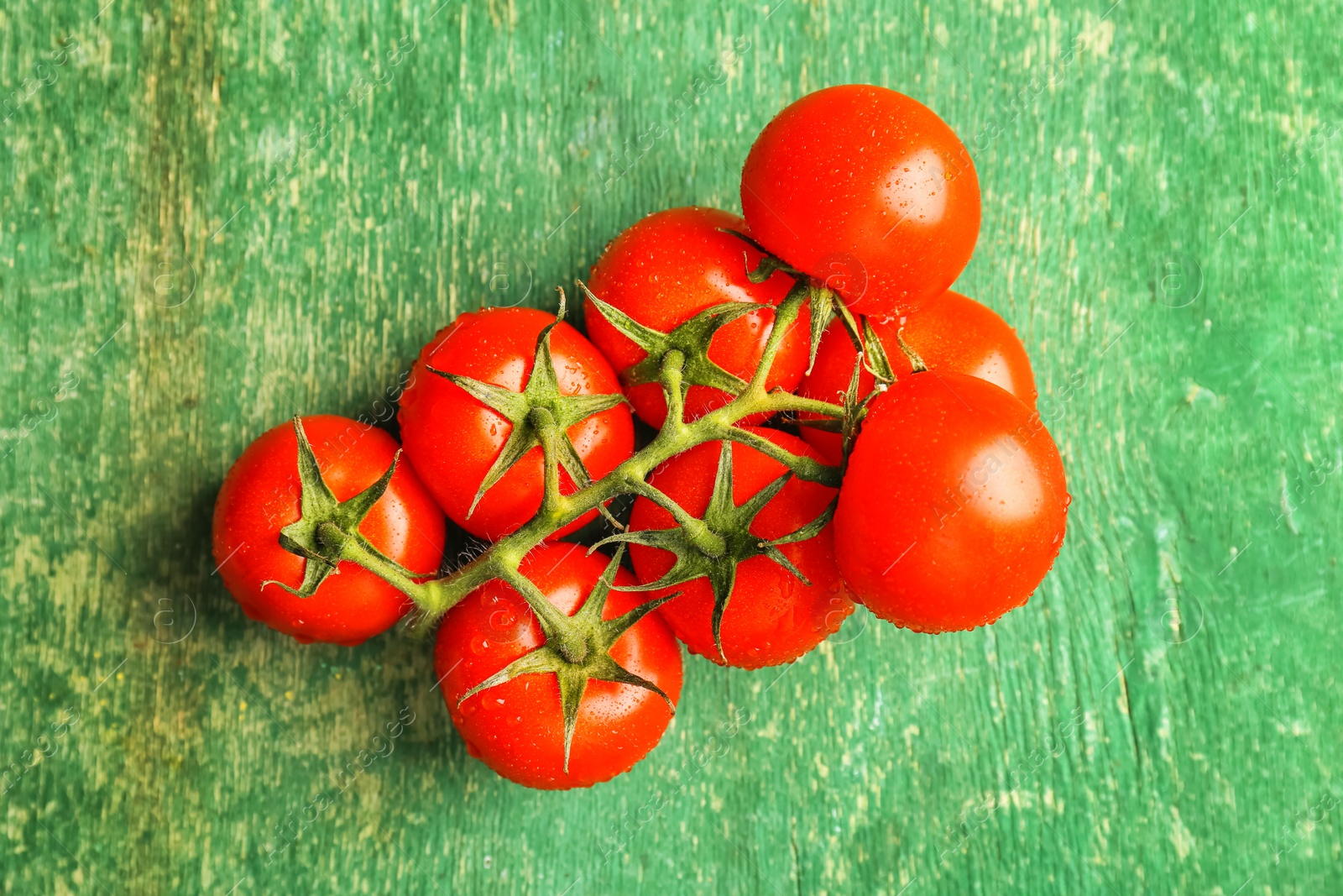 Photo of Fresh ripe tomatoes on wooden background, top view