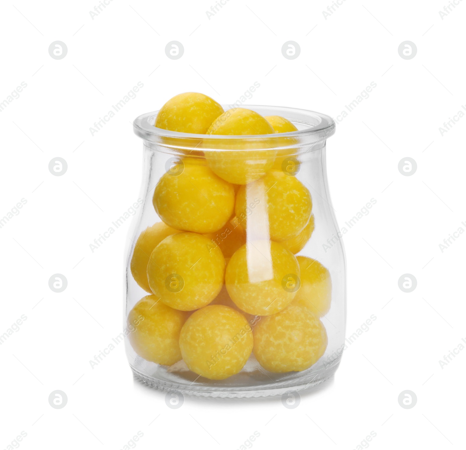 Photo of Tasty small lemon drops in glass jar isolated on white