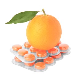 Fresh orange and blisters with cough drops isolated on white