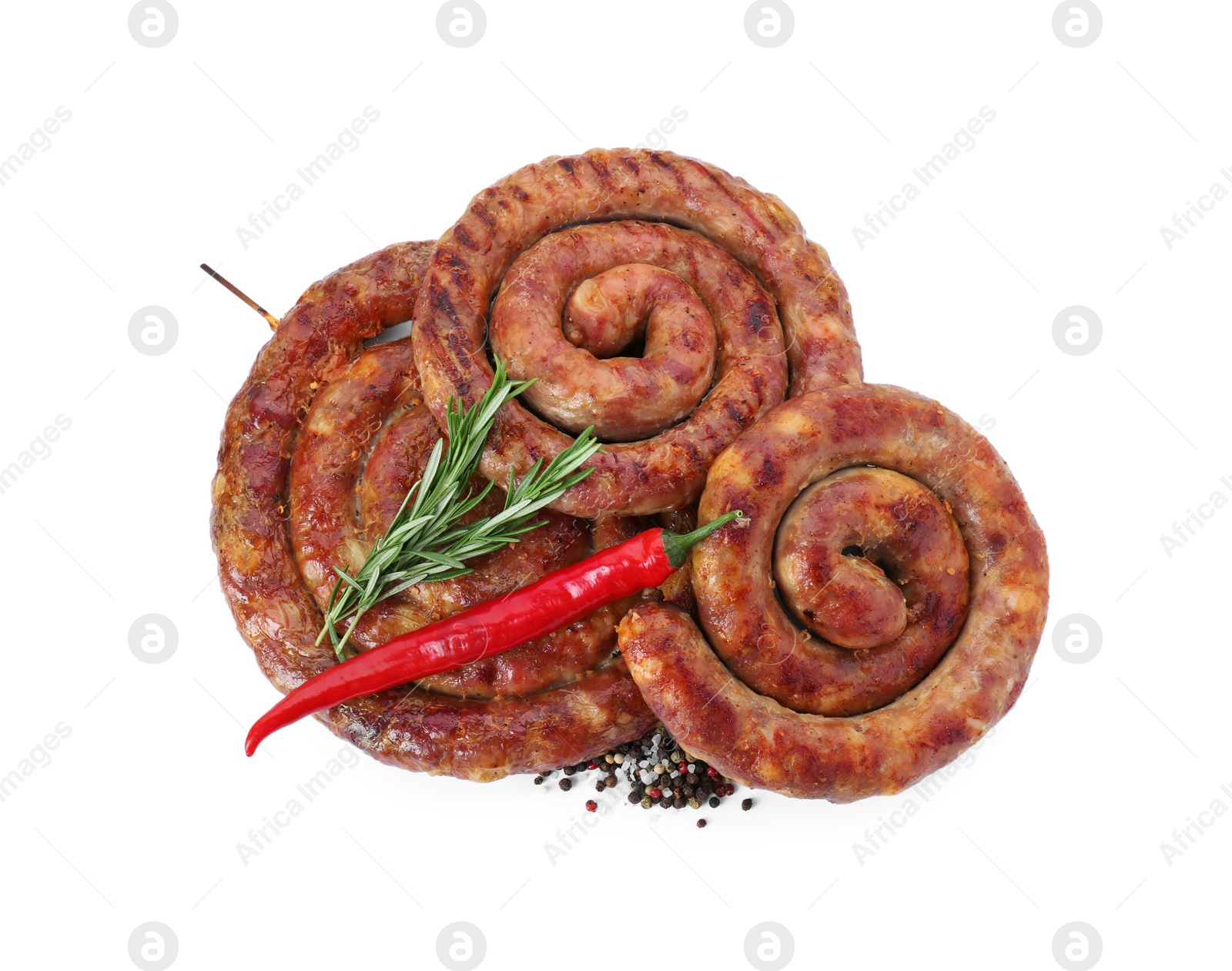 Photo of Rings of delicious homemade sausage with spices and chili pepper isolated on white, top view