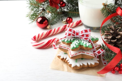 Photo of Delicious Christmas cookies on white wooden table