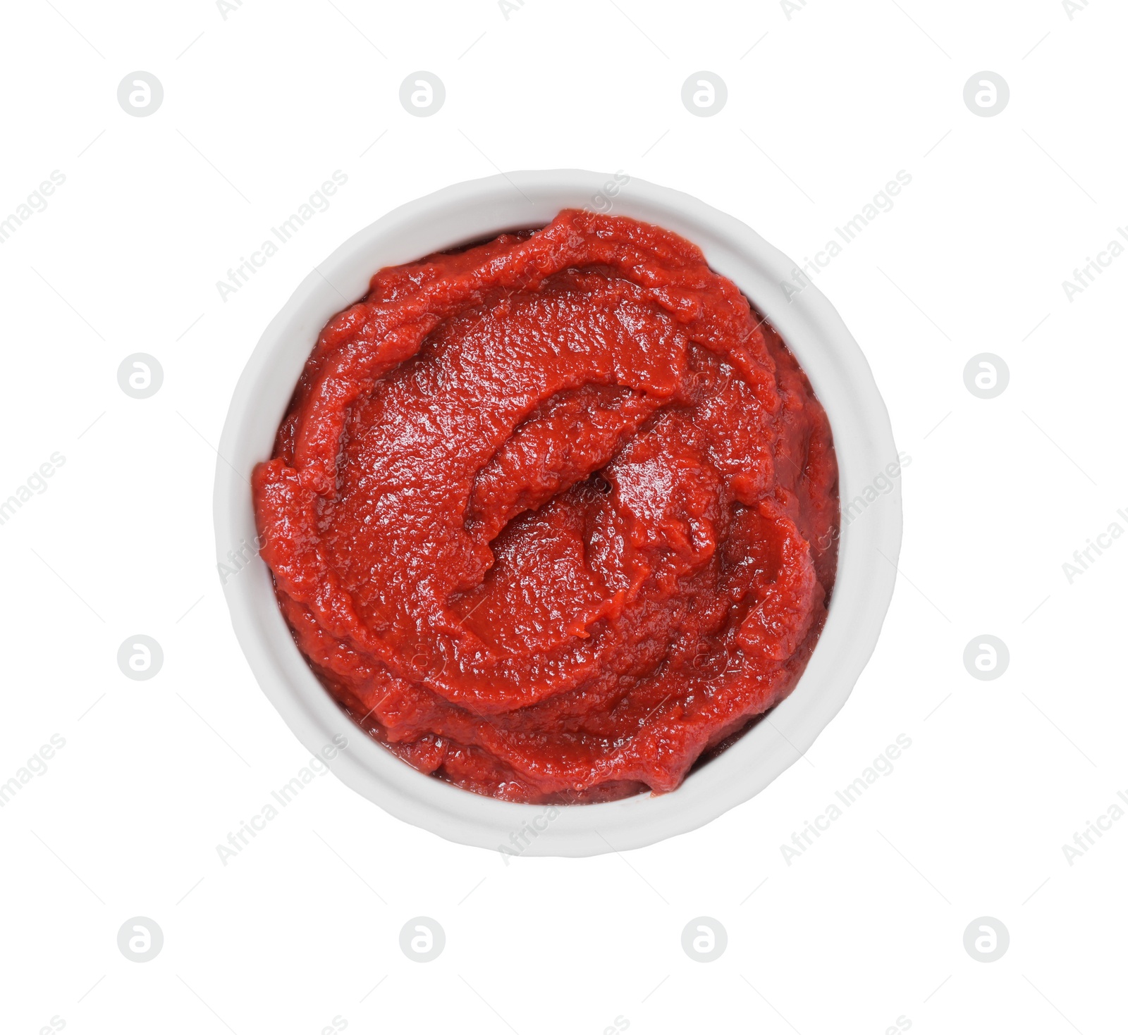 Photo of Bowl of tasty tomato paste isolated on white, top view