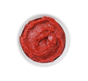 Photo of Bowl of tasty tomato paste isolated on white, top view
