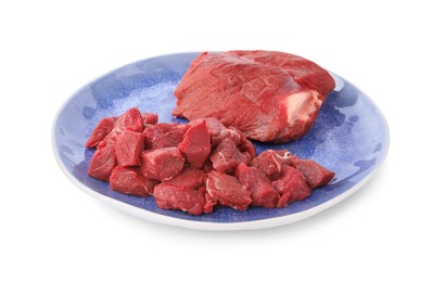 Photo of Plate with pieces of raw beef meat isolated on white