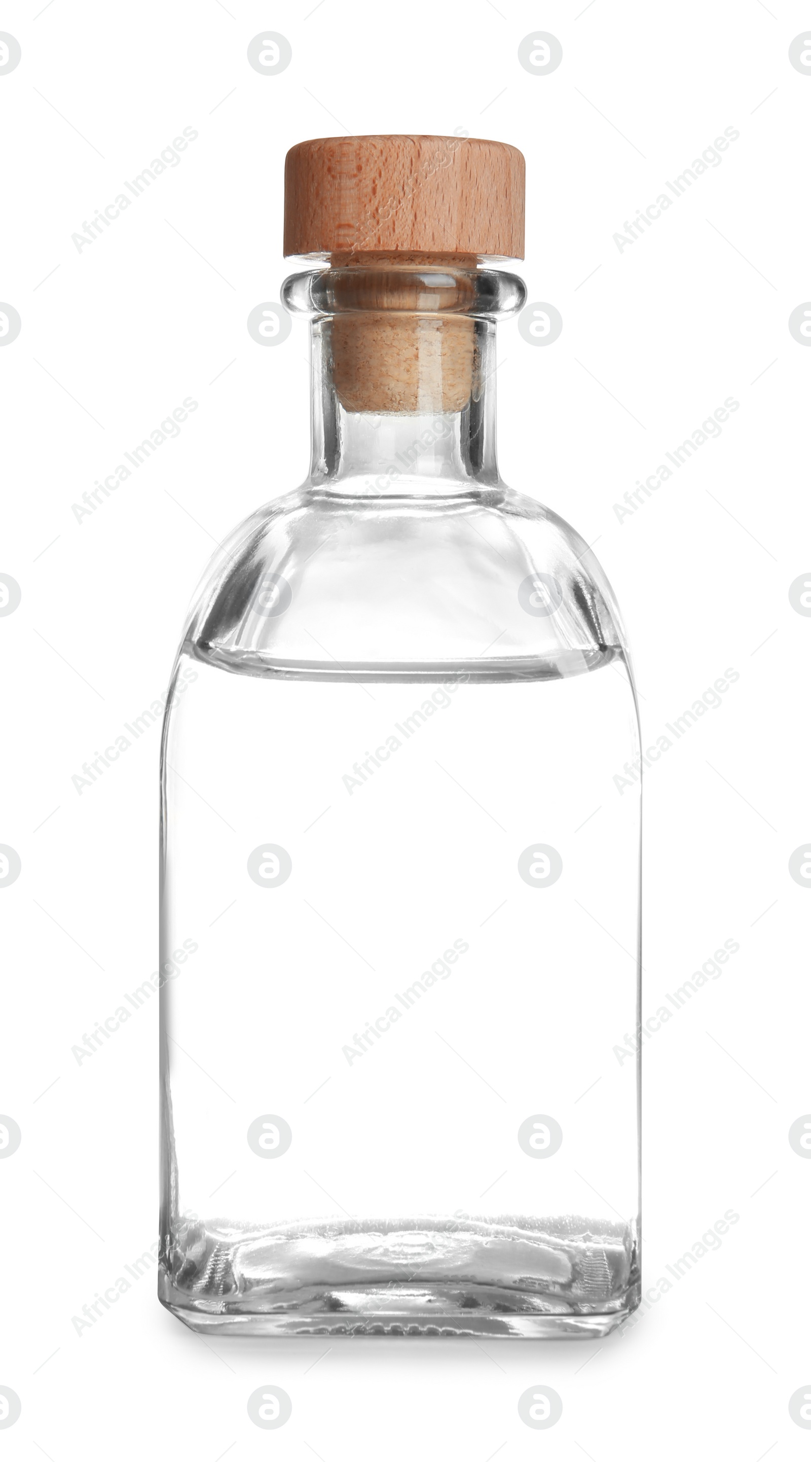 Photo of Glass bottle with vinegar on white background