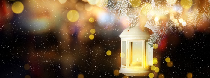 Image of Beautiful Christmas lantern hanging on fir tree branch, bokeh effect. Banner design with space for text