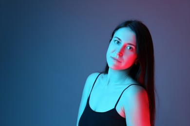 Photo of Portrait of beautiful young woman on color background. Space for text