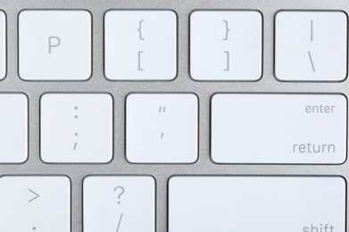 Modern computer keyboard with white buttons, closeup view