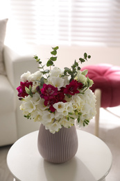 Photo of Beautiful bouquet with spring freesia flowers in light room