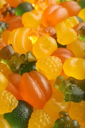 Mix of different delicious gummy candies as background, closeup