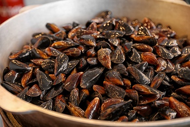 Photo of Many delicious fresh mussels in pan, closeup