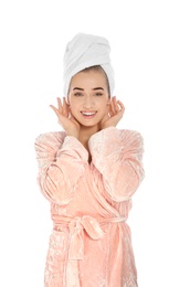 Portrait of young pretty woman in bathrobe with towel on white background